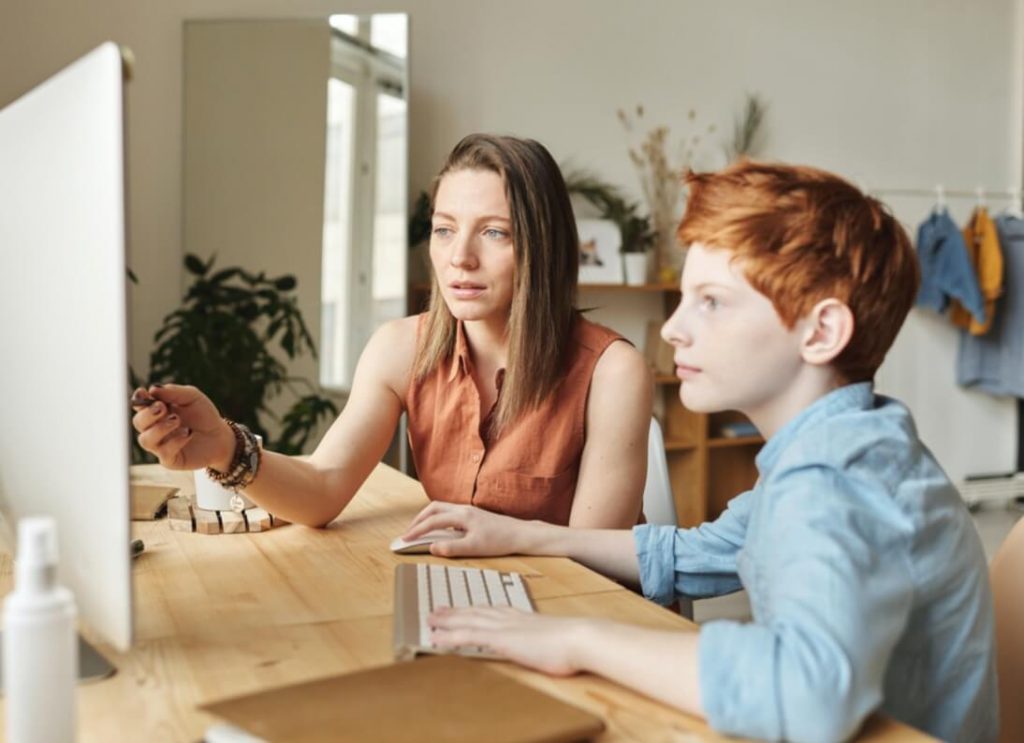 Speech therapist working with a young child during a language therapy session