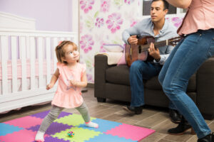 shows parents using music to facilitate language of their toddler