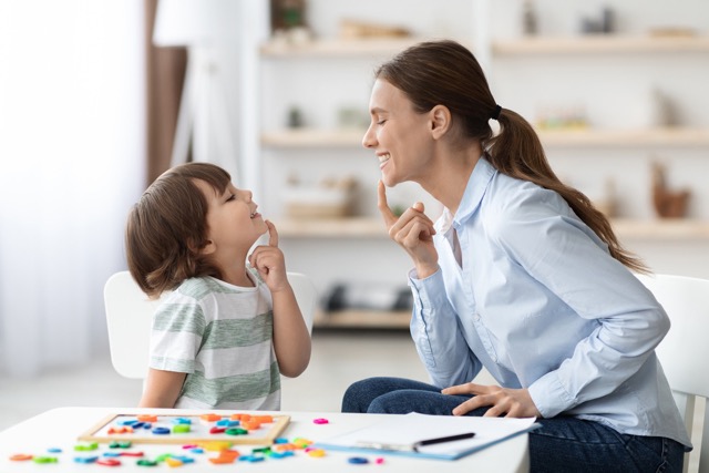 young child receiving speech therapy