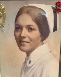 Mary Solares, a dedicated pediatric nurse, in her nursing uniform. She later used augmentative communication as her primary means of communication.